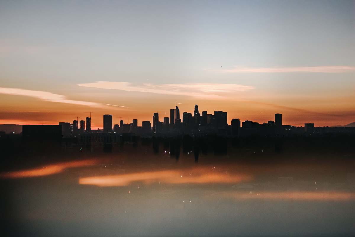 sunrise cityscape of high-rise building during golden hour sunset